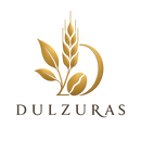 A gold-colored logo featuring wheat, tea leaves, a coffee bean, and a crescent moon above the brand name 'DULZURAS' in dark brown serif lettering, set against a plain white background.